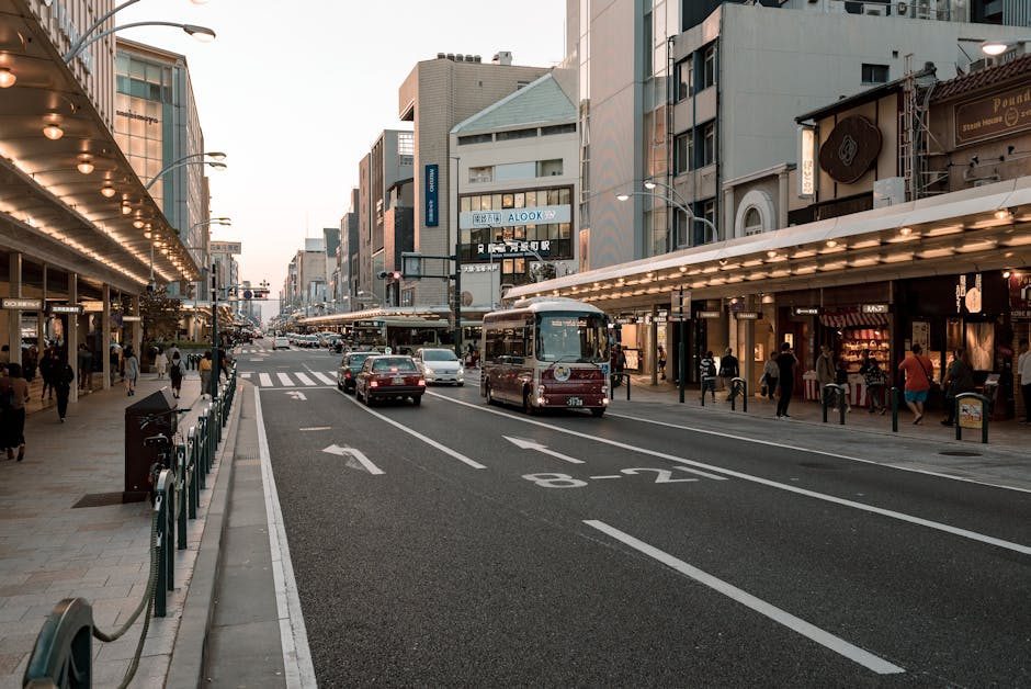 Kyoto city street with bus and pedestrians